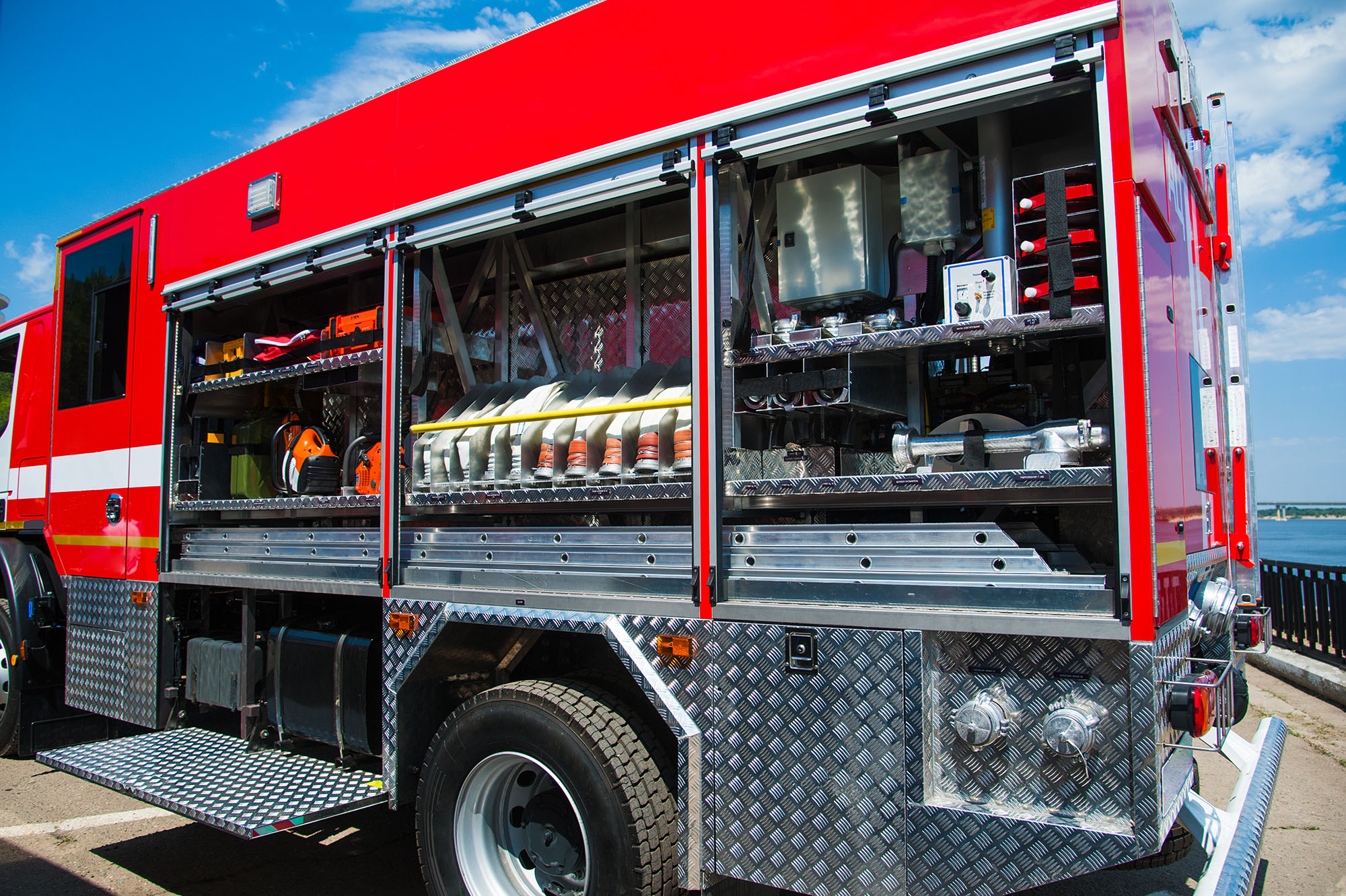 Compartment of rolled up fire hoses on a fire engine. Rescue fire truck equipment; Shutterstock ID 1629971269; search_id: search_id; customer_id: customer_id; geo_location: geo_location; number_viewed: number_viewed